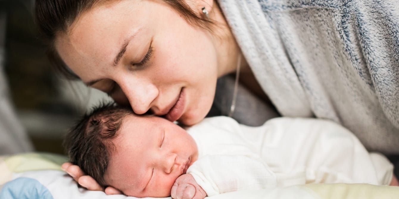 Managing sleep deprivation as a new parent: Strategies for restful nights tired mom and newborn touching faces - sleep deprivation